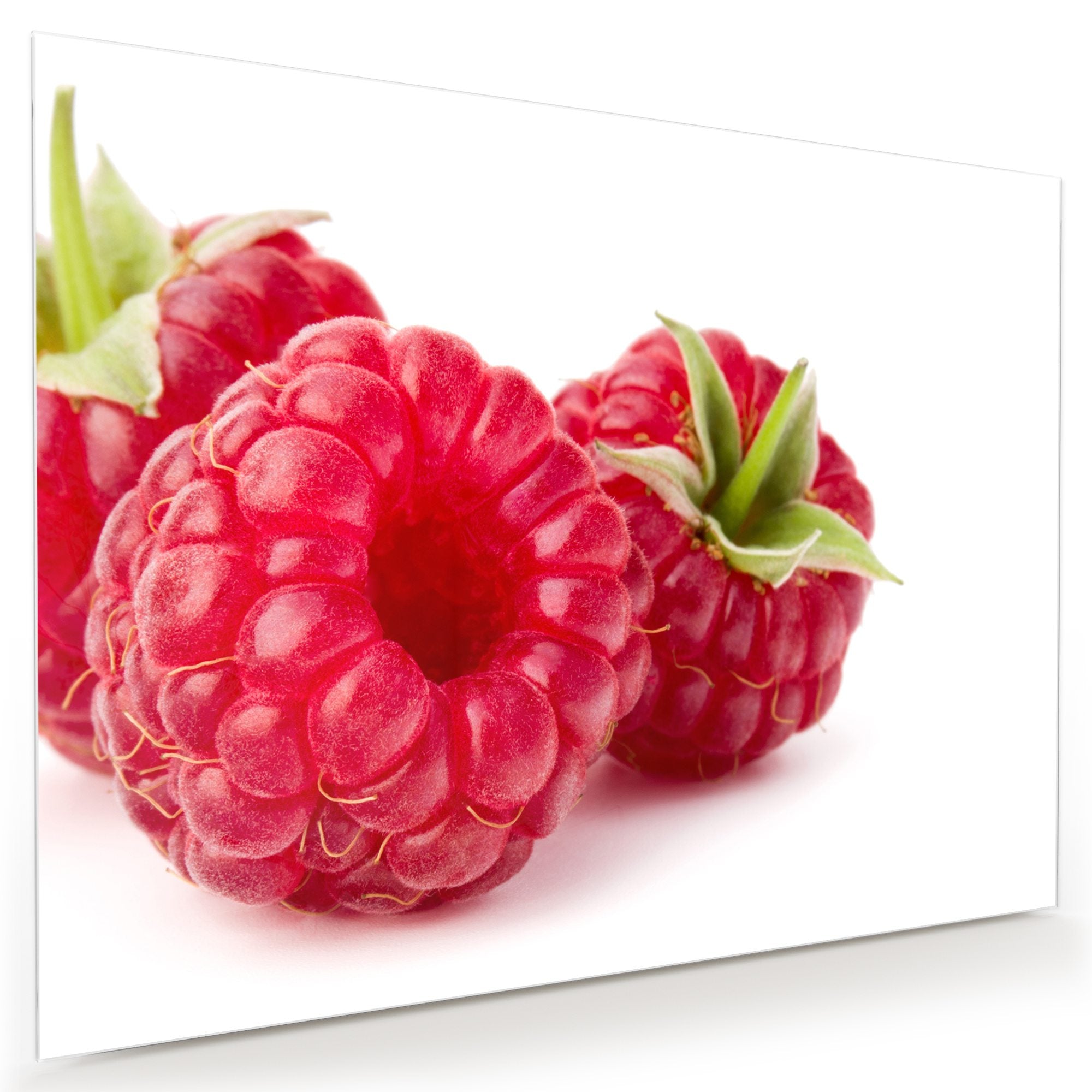 Wandbild - Drei Himbeeren mit Blatt